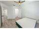 Bright bedroom featuring wood-look floors, ceiling fan, closet and access to an ensuite bathroom at 4007 Bangalow Palm Ct # 4007, Tampa, FL 33624