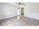 Spacious bedroom featuring laminate floors, a ceiling fan, and natural light from a glass door at 4007 Bangalow Palm Ct # 4007, Tampa, FL 33624