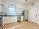 Bright kitchen features stainless steel appliances and sleek, white cabinetry at 4007 Bangalow Palm Ct # 4007, Tampa, FL 33624