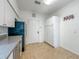 Bright kitchen featuring tile floors, stainless steel appliances, and ample cabinet space at 4007 Bangalow Palm Ct # 4007, Tampa, FL 33624