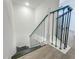 View of the staircase with decorative railing and a combination of carpeted and solid stairs at 4007 Bangalow Palm Ct # 4007, Tampa, FL 33624