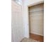 White closet with multiple metal shelving units, great for storage next to the front door at 4007 Bangalow Palm Ct # 4007, Tampa, FL 33624