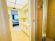 Bathroom featuring a single vanity, bright lighting, and a shower at 933 Harbor S Dr, Venice, FL 34285