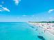 Beautiful beach scene featuring clear turquoise water and a crowded, white sand beach at 933 Harbor S Dr, Venice, FL 34285
