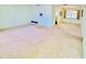 Spacious living room featuring neutral carpet and a large window for plenty of natural light at 933 Harbor S Dr, Venice, FL 34285