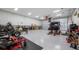 Spacious garage with high ceilings, ample lighting and machinery at 15734 Old Mill Pond Rd, Dade City, FL 33523