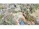 Overhead view of a single-story home on a large parcel with a parcel boundary line in red at 33021 Ranch Rd, Dade City, FL 33523