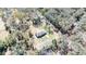 Aerial view of home, situated among lush trees and natural landscape at 33021 Ranch Rd, Dade City, FL 33523
