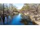 Scenic view of a tranquil creek surrounded by lush trees and natural beauty at 33021 Ranch Rd, Dade City, FL 33523