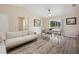 Comfortable dining area adjacent to living room, with table, chairs, and natural light at 33021 Ranch Rd, Dade City, FL 33523