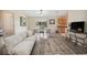 Bright, airy living area open to dining space, featuring stylish furniture and natural light at 33021 Ranch Rd, Dade City, FL 33523