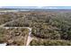 Aerial view of the home site showing it's proximity to a small lake at 7157 Knoxville Dr, Webster, FL 33597