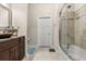 Bright bathroom featuring a shower and tub combo with neutral tile at 7157 Knoxville Dr, Webster, FL 33597