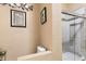 Bathroom featuring a toilet next to a glass enclosed tiled shower at 7157 Knoxville Dr, Webster, FL 33597