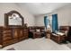 Cozy bedroom featuring comfortable leather furniture and a dresser with a large mirror at 7157 Knoxville Dr, Webster, FL 33597