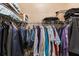 Walk-in closet with shelving and hanging clothes at 7157 Knoxville Dr, Webster, FL 33597