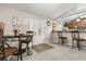 Bright dining area with a table set near the entry and an open kitchen with counter seating at 7157 Knoxville Dr, Webster, FL 33597