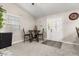Inviting dining room features neutral carpet, a decorative table, and a front entrance view at 7157 Knoxville Dr, Webster, FL 33597