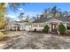 Charming single Gathering home with covered entrance and decorative shutters under a clear blue sky at 7157 Knoxville Dr, Webster, FL 33597
