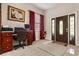 Foyer with carpeted entryway, adjacent office space, and a wood double-door entrance to the home at 7157 Knoxville Dr, Webster, FL 33597