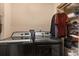 Functional laundry room with a washer, dryer, storage shelves, and folding area at 7157 Knoxville Dr, Webster, FL 33597