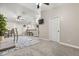 Living area showing carpet, furnishings, and open layout to dining and kitchen at 7157 Knoxville Dr, Webster, FL 33597
