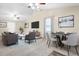 Open concept living room and dining area with stylish furniture and plenty of natural light at 7157 Knoxville Dr, Webster, FL 33597