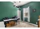 Small office with green walls, a window, and a desk with computer at 7157 Knoxville Dr, Webster, FL 33597