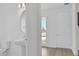 This view of the bathroom includes the sink, toilet and a view of the front yard at 196 Eagleston Ln, Lakewood Ranch, FL 34240