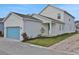 Stylish house with a side garage and a lovely, landscaped front yard at 196 Eagleston Ln, Lakewood Ranch, FL 34240