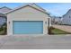 Spacious garage door with stylish lighting and landscaping at 196 Eagleston Ln, Lakewood Ranch, FL 34240