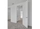 Hallway featuring a neutral-toned carpet and white doors at 196 Eagleston Ln, Lakewood Ranch, FL 34240