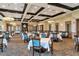 Large banquet hall featuring elegant lighting, tables, and chairs for special events at 7005 River Hammock Dr # 207, Bradenton, FL 34212