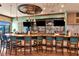 Upscale bar area boasting a stylish design, ample seating, and a fully stocked counter at 7005 River Hammock Dr # 207, Bradenton, FL 34212