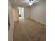 Cozy bedroom with neutral carpet, ceiling fan, and access to an ensuite bathroom at 7005 River Hammock Dr # 207, Bradenton, FL 34212