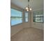 Bright breakfast nook offering serene water views and modern lighting at 7005 River Hammock Dr # 207, Bradenton, FL 34212