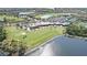 Aerial view of community with golf course, lakes, and clubhouse at 7005 River Hammock Dr # 207, Bradenton, FL 34212