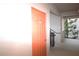 Hallway featuring unit doorway and staircase with exterior view from open-air corridor at 7005 River Hammock Dr # 207, Bradenton, FL 34212