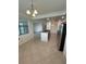 Stylish kitchen with an island, stainless steel appliances, and tile floors at 7005 River Hammock Dr # 207, Bradenton, FL 34212