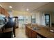 Modern kitchen with granite countertops, stainless steel appliances, and a cozy breakfast nook at 7005 River Hammock Dr # 207, Bradenton, FL 34212
