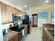 Modern kitchen features stainless steel appliances, granite counters, and ample cabinet space at 7005 River Hammock Dr # 207, Bradenton, FL 34212