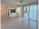 Inviting living room with tile floors and sliding doors to screened lanai, and open to the kitchen at 7005 River Hammock Dr # 207, Bradenton, FL 34212
