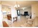 Open floor plan with a kitchen, dining area, living area, and access to an outdoor seating area at 7005 River Hammock Dr # 207, Bradenton, FL 34212