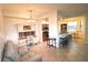 Open concept living area with a desk area, kitchen with bar seating, adjacent to the the living area at 7005 River Hammock Dr # 207, Bradenton, FL 34212