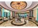 Elegant lobby featuring a decorative ceiling, marble floors, and comfortable seating area at 7005 River Hammock Dr # 207, Bradenton, FL 34212