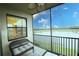 Relaxing screened patio overlooking a serene lake view, perfect for enjoying outdoor living at 7005 River Hammock Dr # 207, Bradenton, FL 34212