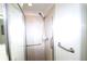 Modern tiled shower with glass doors and convenient grab bars for safety at 7005 River Hammock Dr # 207, Bradenton, FL 34212
