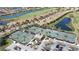 Aerial view of tennis courts, clubhouse, and community at 7005 River Hammock Dr # 207, Bradenton, FL 34212