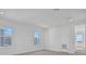 A bedroom with natural light features neighborhood views, neutral carpet, and a bright blank canvas for personalization at 9015 Rothman Ln, Lakewood Ranch, FL 34240