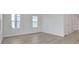 Spacious living room with natural light, showcasing the home's bright and airy ambiance at 9015 Rothman Ln, Lakewood Ranch, FL 34240